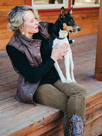 Photo of author Susan Corning and Scruffy the dog